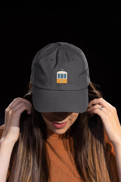 Fashion-forward unisex cap featuring a Lisbon tram logo, ideal for city lovers.