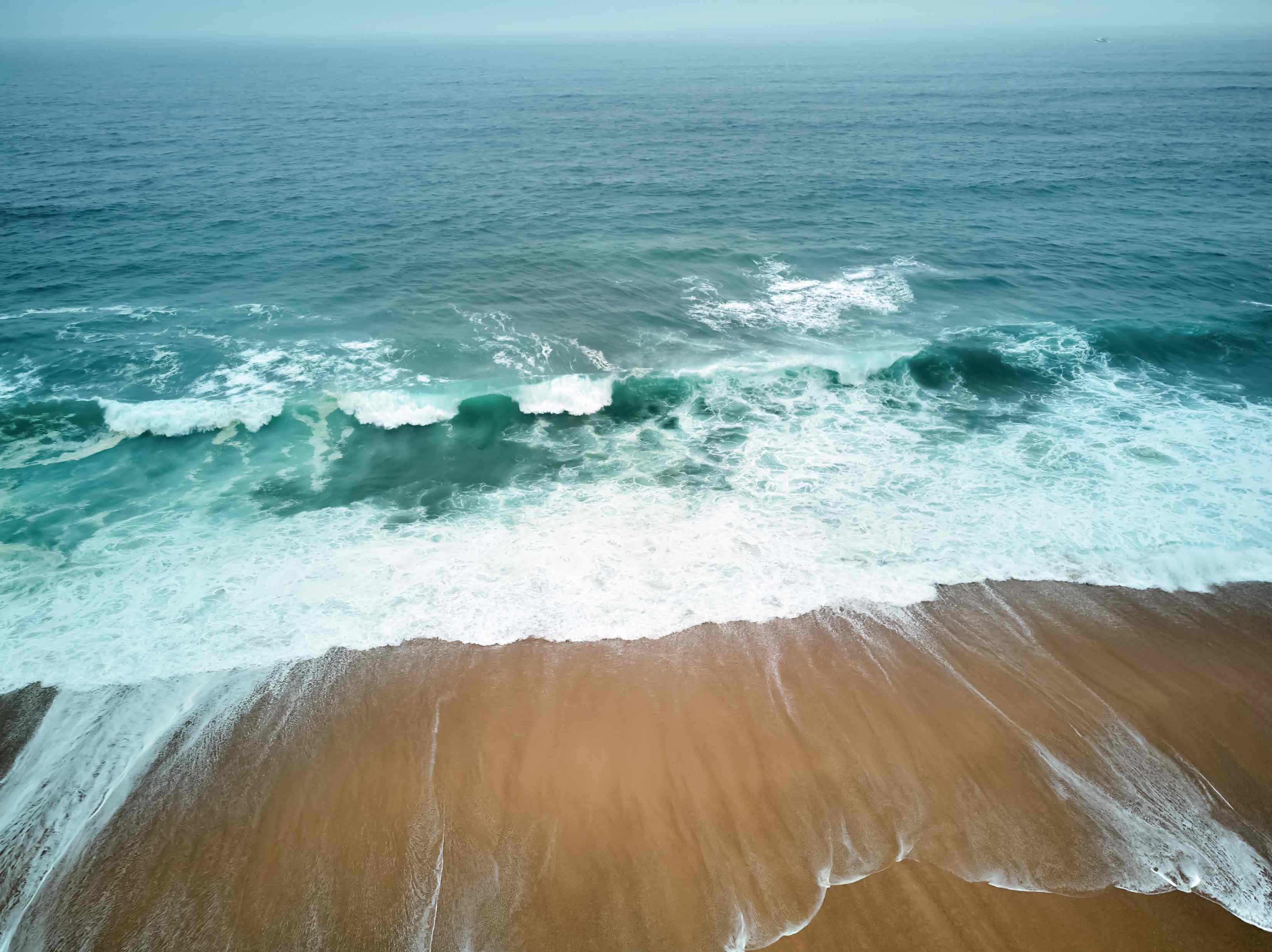 Sandy beach in Algarve, Portugal. Inspiration of Atlantic Wave brand.