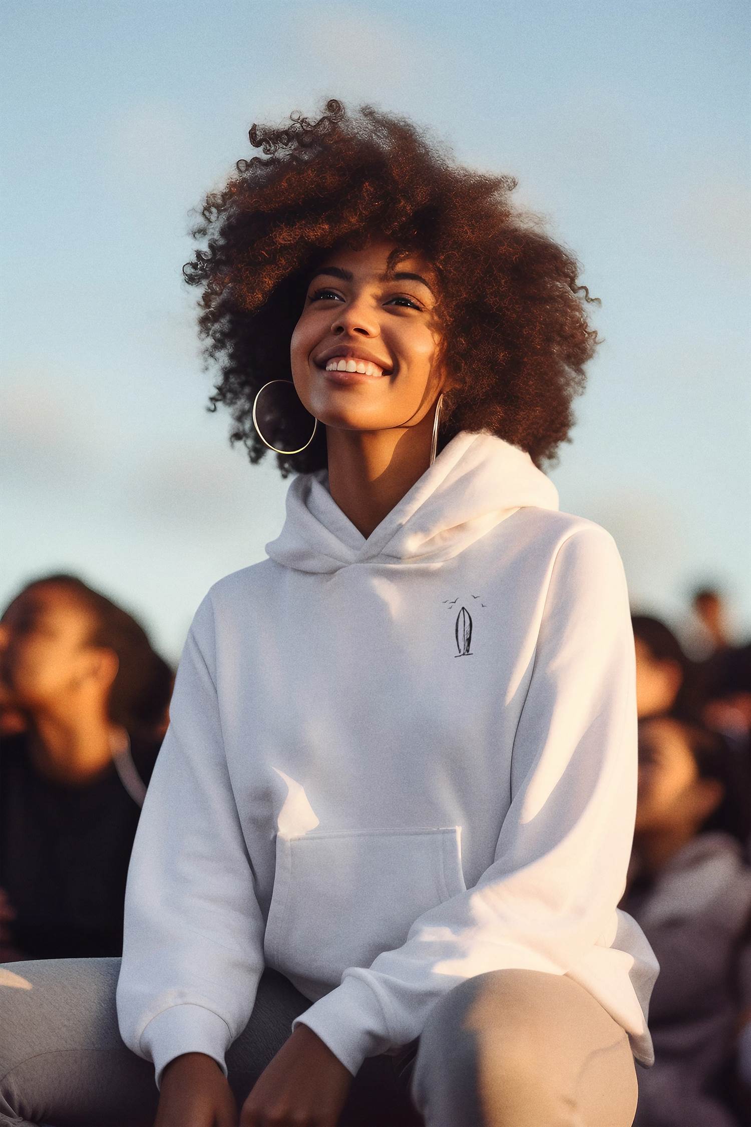 Fashion-forward unisex hoodie featuring a surfboard logo, ideal for surf enthusiasts