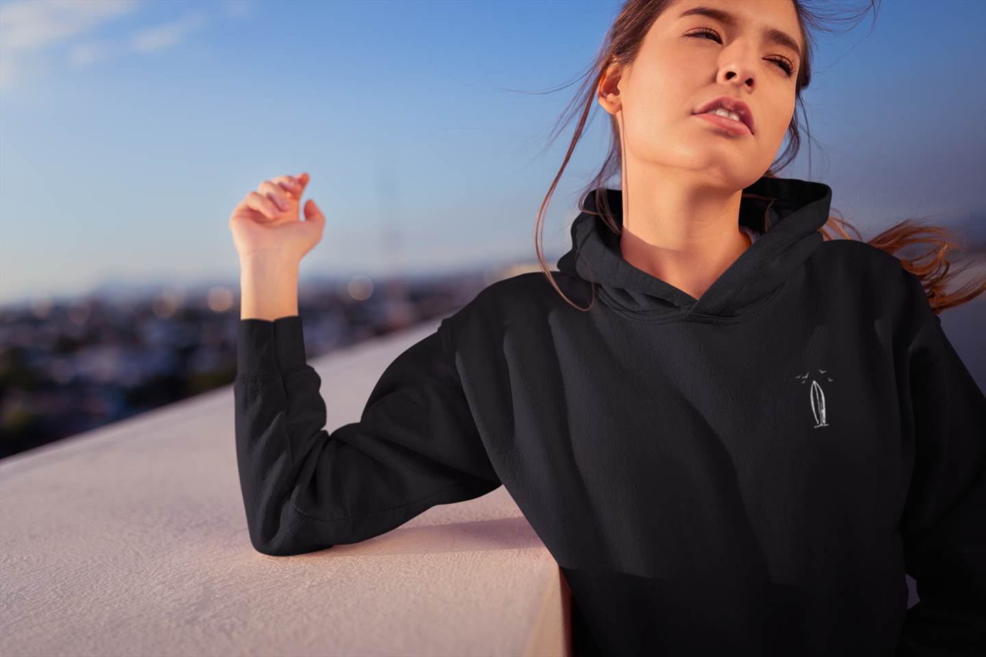 Minimalist surfboard hoodie with an eco-friendly tag inspired by Nazare