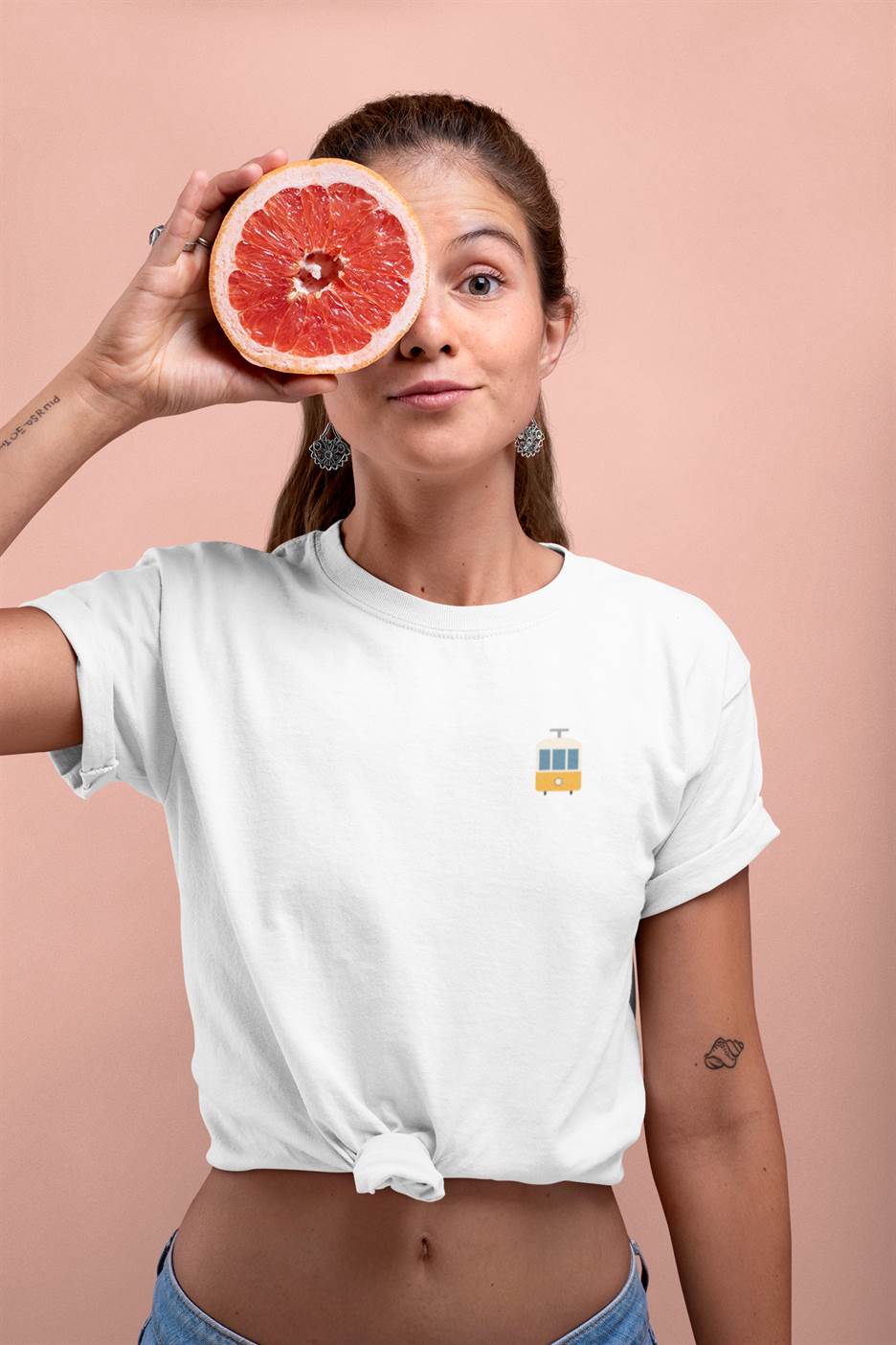 Woman elegantly wearing the Lisbon Tram T-Shirt, reflecting Lisbon’s urban charm